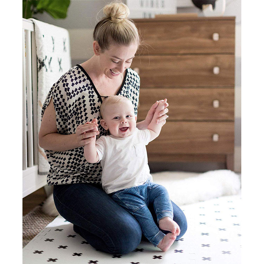 Woman and Baby Sitting on Brooklyn Cross Black and White Baby Play Mat