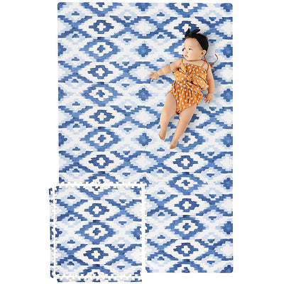 Infant Laying on Jackson Rug Blue Play Mats